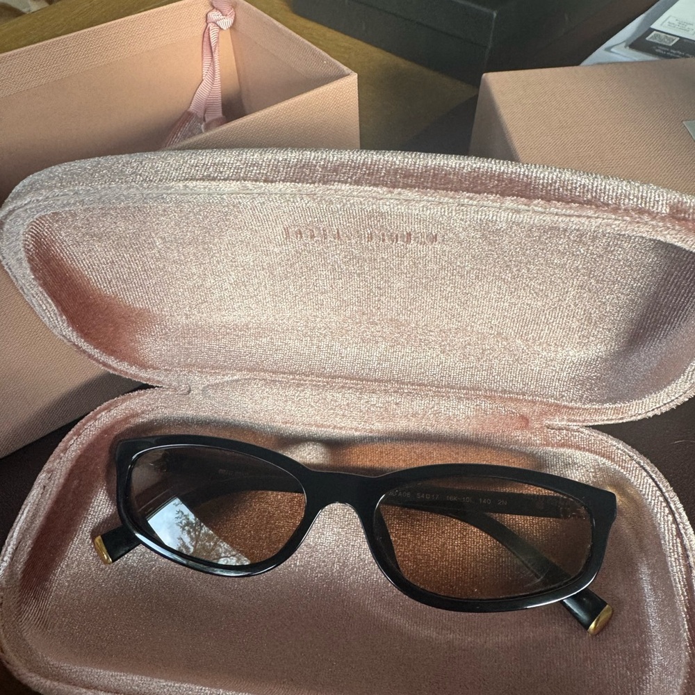 Miu Miu Black Sunglasses with Gold Accents